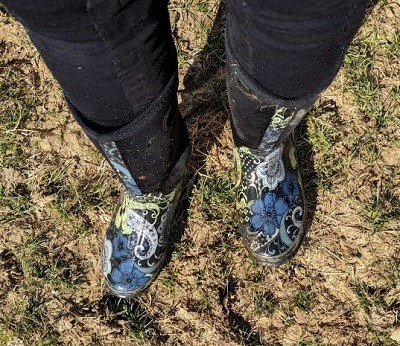 Picture of floral boots standing on the ground.